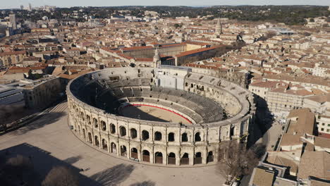 Aerial-back-traveling-over-the-Arena-of-Nîmes-is-a-Roman-amphitheatre-sunny-day